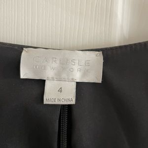 This is a full leather vest zip up the back very close fitting to the body